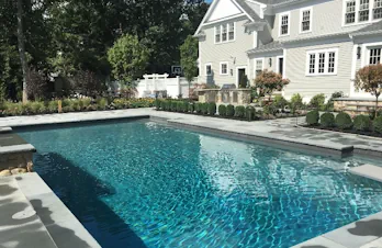 Luxurious pool and outdoor kitchen in Wellesley, Massachusetts