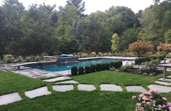 Luxurious Pool and Spa with Elegant Stone Patio in Wellesley, Massachusetts