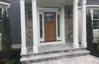 Groton, Mass - Stone veneer on face of house and columns with blue stone cap and tile.