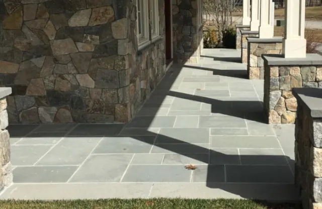 Groton, Mass - Stone veneer on face of house and columns with blue stone cap and tile.